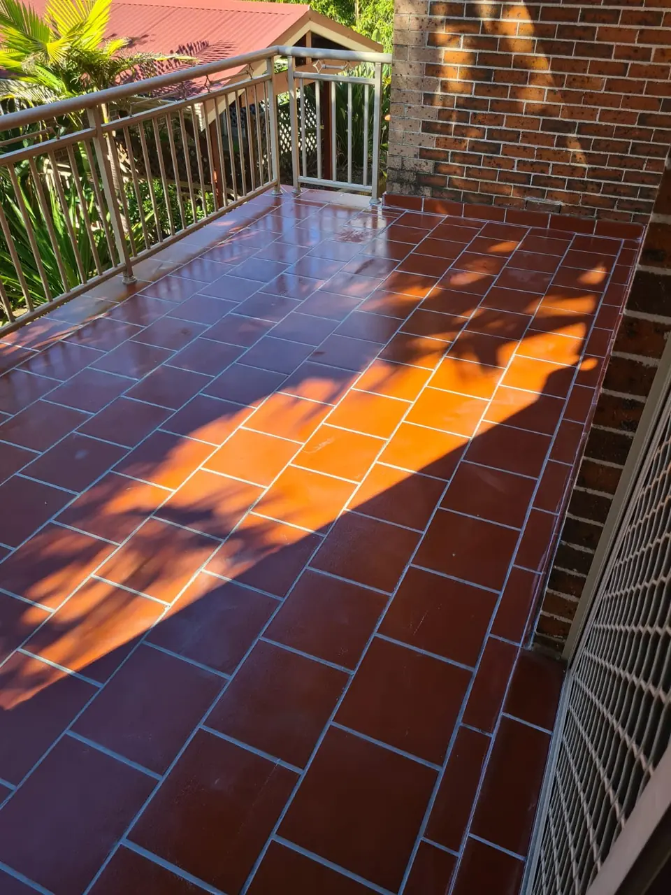 After: the balcony regrouted and sealed.