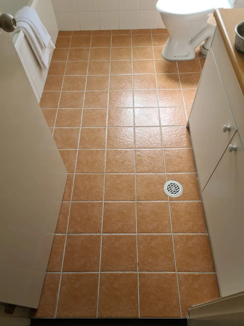 After: the same floor with fresh grout.